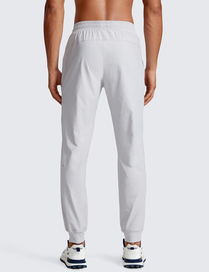 CRZ YOGA Athletic Joggers for Men 29 inch Lightweight Water Resistant Outdoor Workout Pants with Zip Pockets