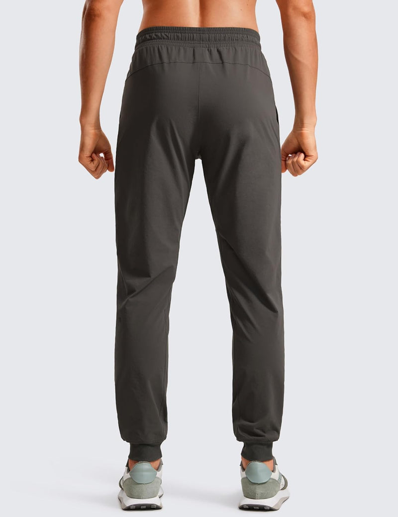 CRZ YOGA Athletic Joggers for Men 29 inch Lightweight Water Resistant Outdoor Workout Pants with Zip Pockets