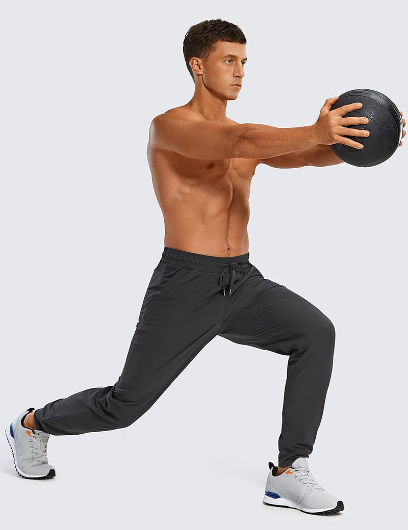 CRZ YOGA Athletic Joggers for Men 29 inch Lightweight Water Resistant Outdoor Workout Pants with Zip Pockets