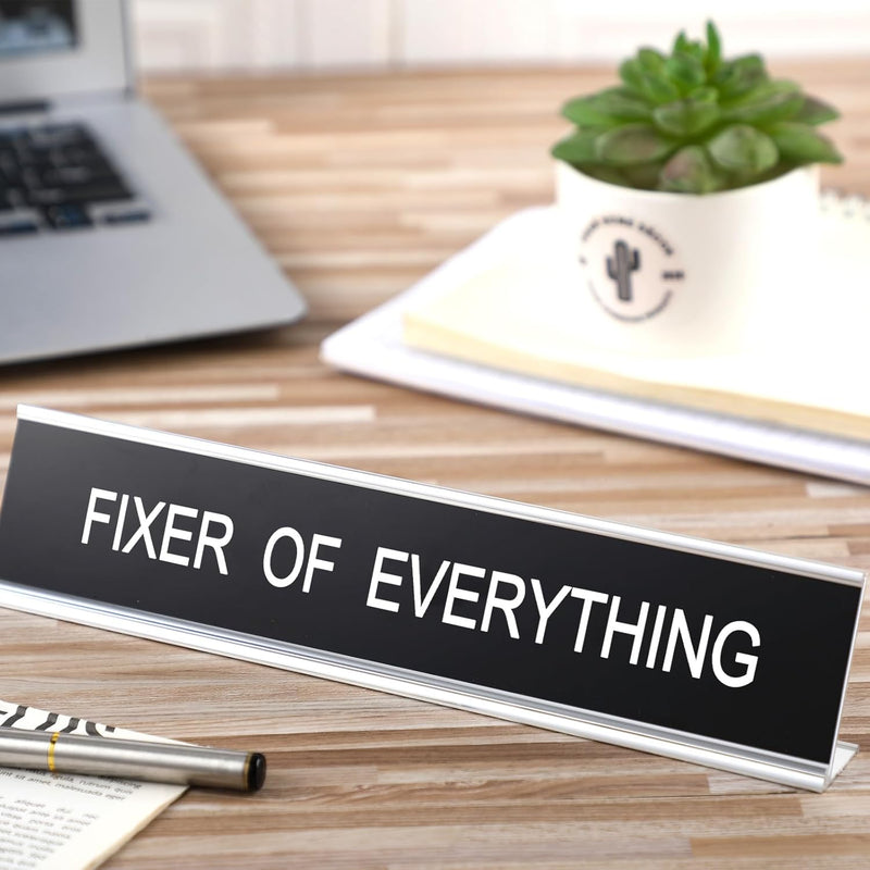 Menkxi Funny Desk Signs for Office, Novelty Nameplate Funny Office Decor Black Desk Plaque for Women Men Coworker Gift Office Home Desk Supply Accessories, 10 x 2 Inch (Fixer of Everything)