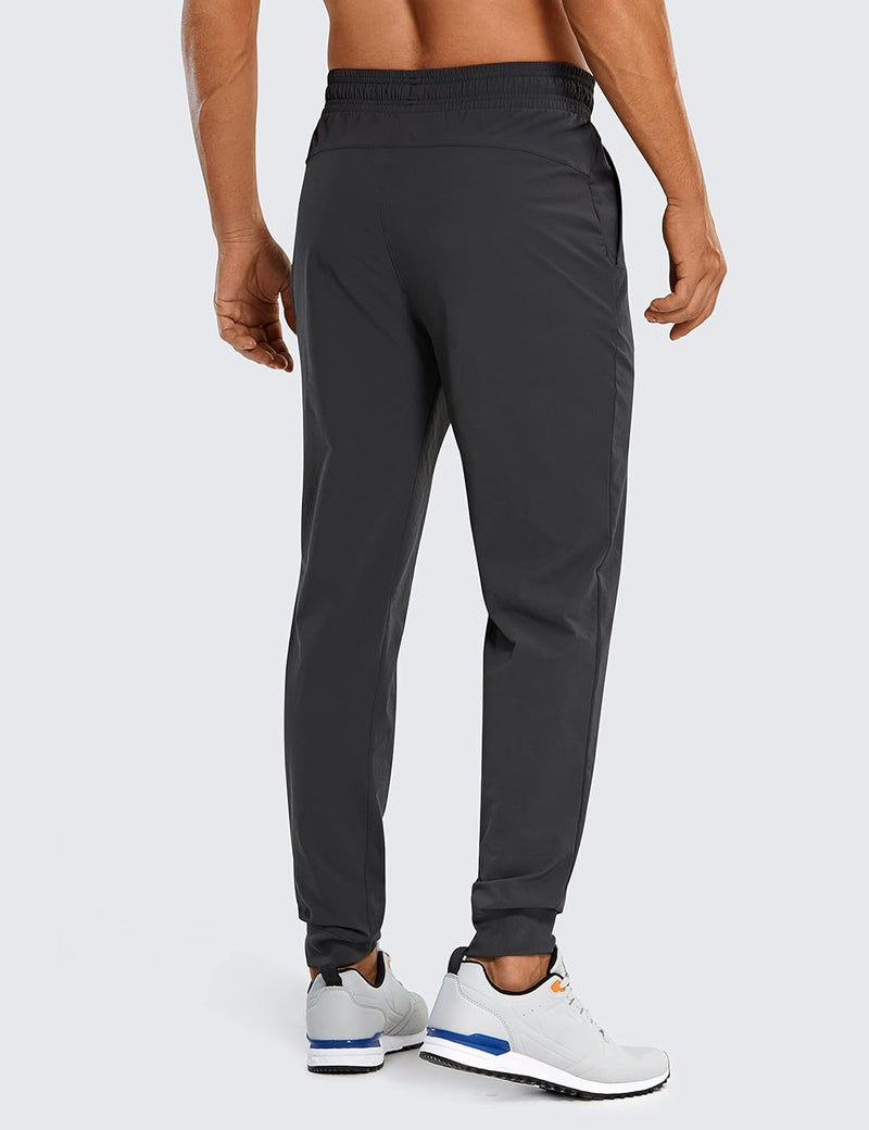 CRZ YOGA Athletic Joggers for Men 29 inch Lightweight Water Resistant Outdoor Workout Pants with Zip Pockets