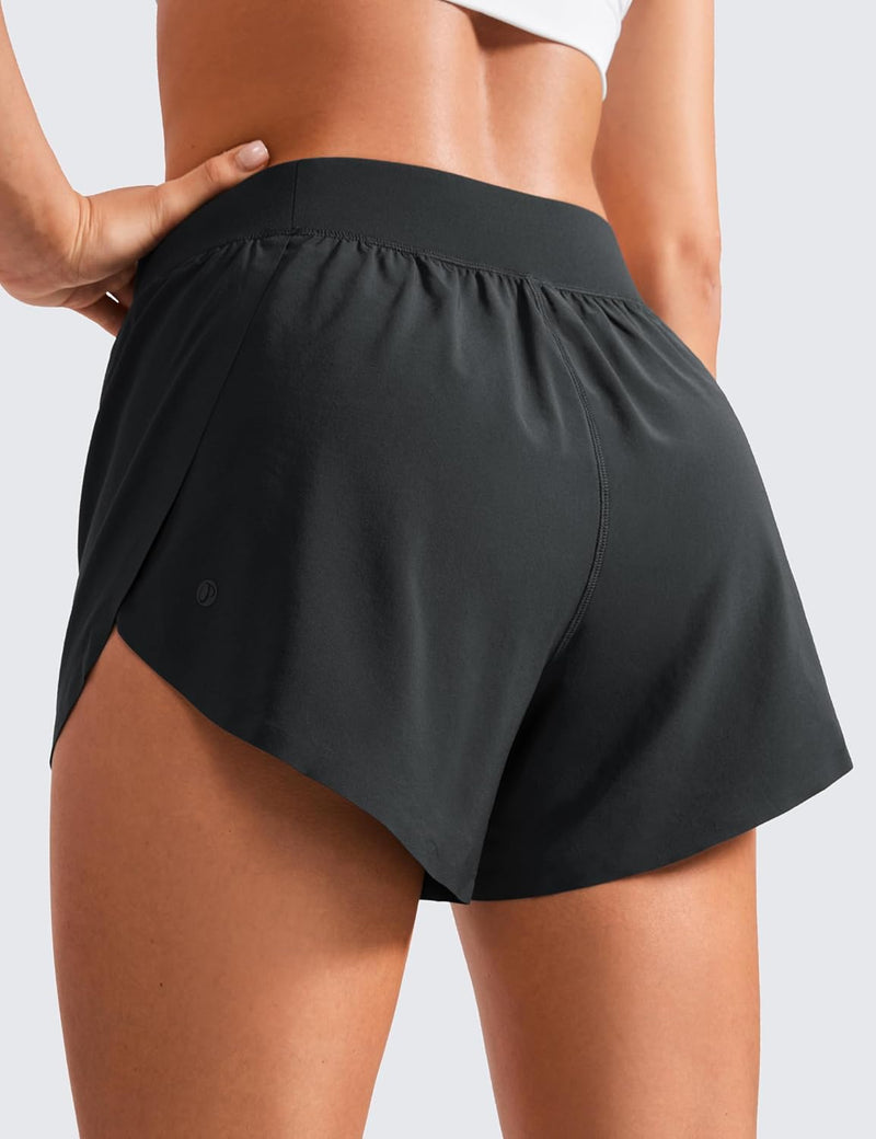 CRZ YOGA Mid Waisted Dolphin Athletic Shorts for Women Lightweight High Split Gym Workout Shorts with Liner Quick Dry
