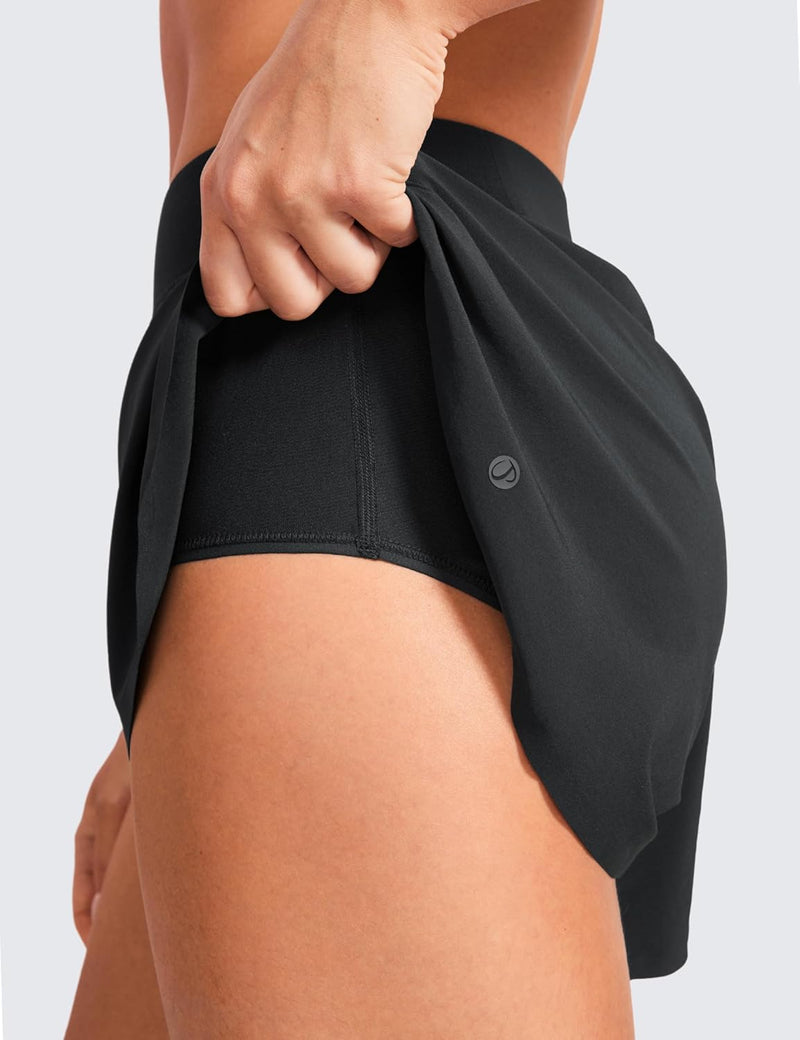CRZ YOGA Mid Waisted Dolphin Athletic Shorts for Women Lightweight High Split Gym Workout Shorts with Liner Quick Dry