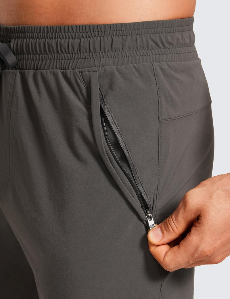 CRZ YOGA Athletic Joggers for Men 29 inch Lightweight Water Resistant Outdoor Workout Pants with Zip Pockets